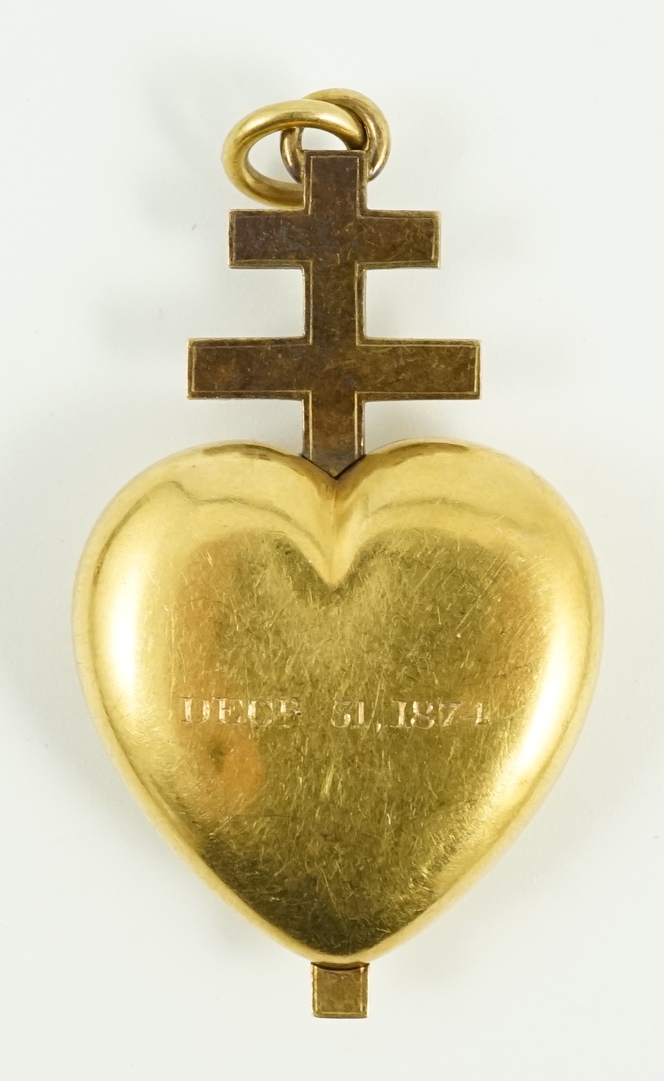 A Victorian gold heart shaped mourning pendant locket, with enamelled monogram